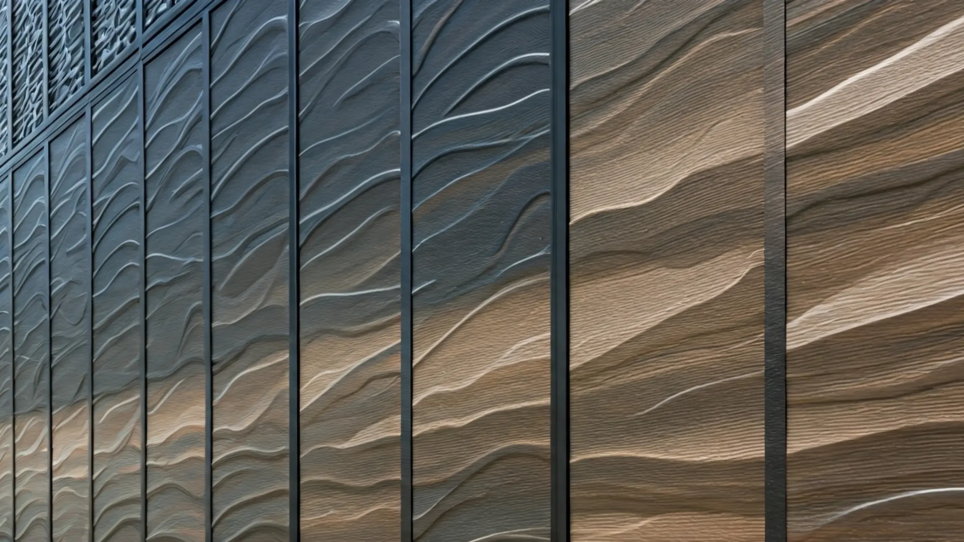 A row of vertical metal fence panels featuring a raised wave-like texture that flows across each panel. The surface design creates the appearance of rippling movement, with gradient tones shifting from dark gray to bronze and beige. Black vertical supports separate each panel, enhancing the modern, artistic look of the fence.